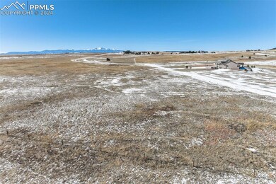 Birds eye view of property with a rural view