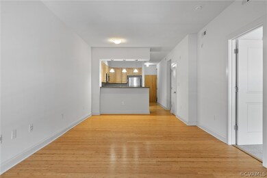 Corridor with light hardwood / wood-style floors