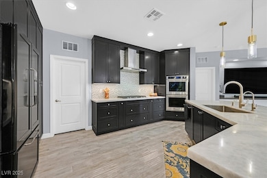 Kitchen featuring appliances with stainless steel