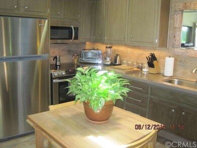 Kitchen with stainless refrigerator, stove/oven, &