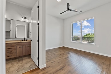 Unfurnished bedroom with wood finished floors, co