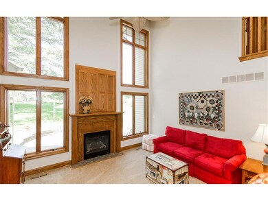 Dramatic 2 story great room with gas fireplace
