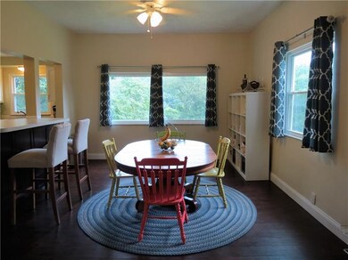 THE KITCHEN OPENS TO THE DINING ROOM AND THE ISLAN