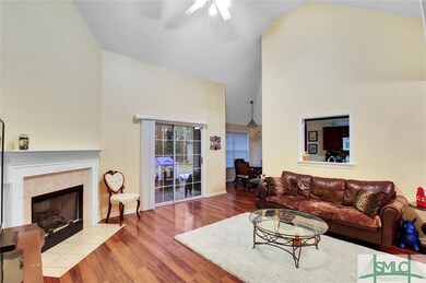 Living room area with gas fireplace to keep you wa