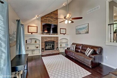 Large Great Room with high ceilings and brick fire