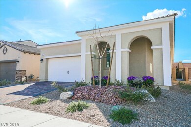 Features paver driveway and walkway
