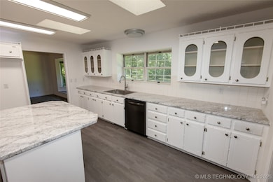 Lots of cabinets and counter tops.