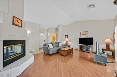 Living room featuring light wood-style flooring, a