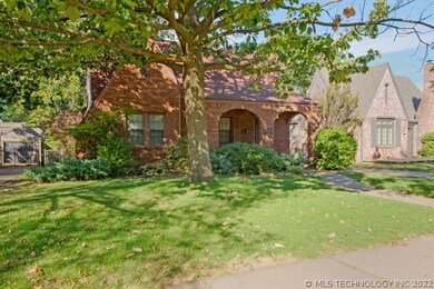 The curb appeal of this home features the archways