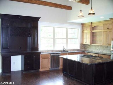 Kitchen - granite counter/wine container/hardwood 