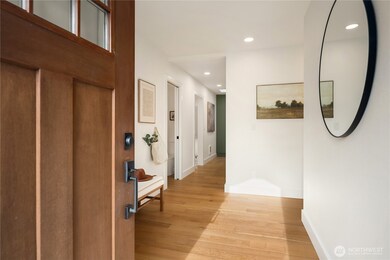The formal entry opens up to a stunningly beautiful remodel that is move-in ready.