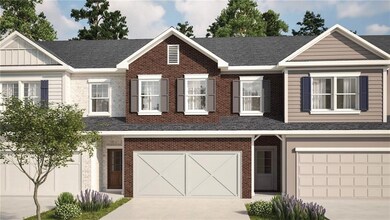 View of property with a garage, driveway, and brick siding