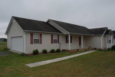 Offering a large, covered front porch, low maintanence landscaping, vinyl siding, & more!