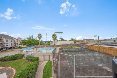 View from front door balcony of pool and tennis co