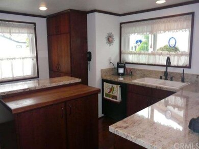 Center Island with granite and chopping block seat
