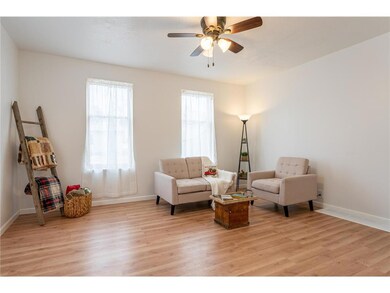 The living room has new flooring, new sheetrock ce