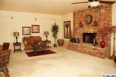 The family room off the kitchen is large enough fo