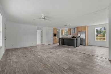 Unfurnished living room with baseboards, ceiling f