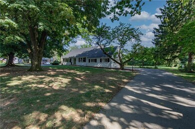 A long driveway leads to an attached 2 car garage,