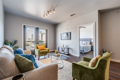 Living area featuring wood finished floors and baseboards
