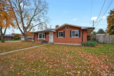 Bungalow-style home with brick siding and a chimney