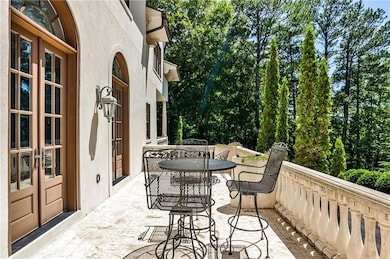 Stone terrace spans the front of the house, accessible from dining and family rooms. Perfect for entertaining.