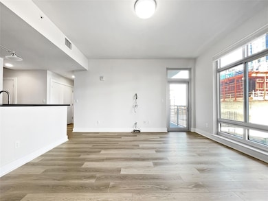 Unfurnished living room featuring light wood-styl