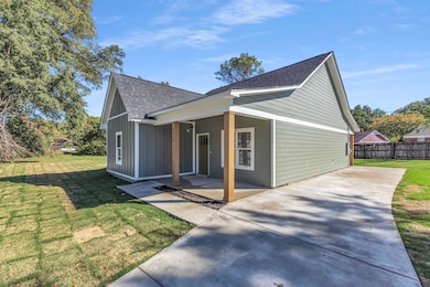 View of front of home featuring roof with shingles and board and batten siding
