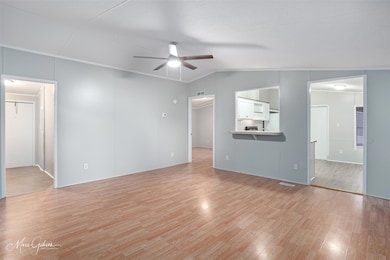 Unfurnished living room featuring light hardwood /