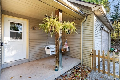 Doorway to property featuring a garage