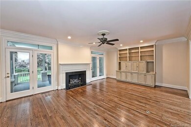 Family Room with Gas Fireplace and Double Doors Le