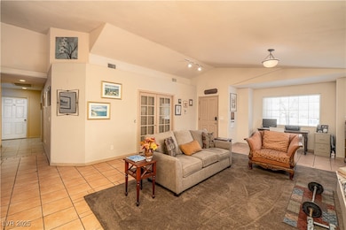 Living area featuring light tile patterned floors,