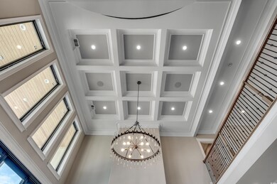 Room details featuring coffered ceiling, beam ceil