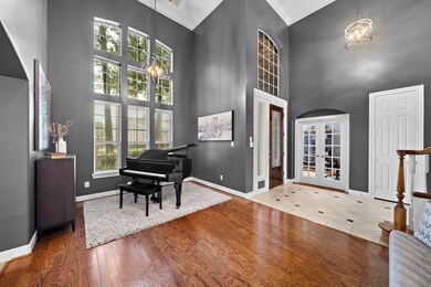 Welcome to the grand entryway, you'll find plenty of natural light along with a sitting area.