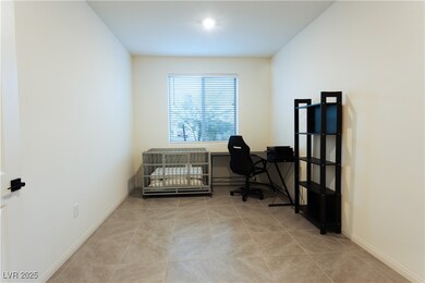 Office featuring tile patterned flooring and baseb