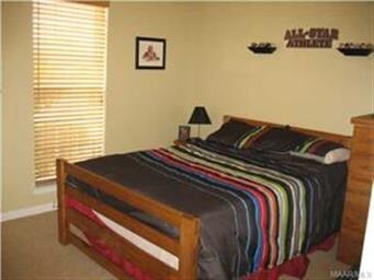 Second bedroom with double paneled doors to closet