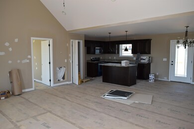 Open floor plan.  Living area has vaulted ceiling. Master bedroom is the door to the left. 