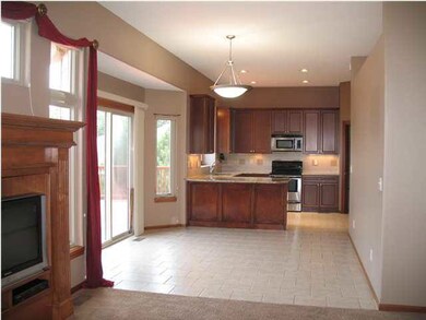 Tiled floor extends to eating space off the kitche