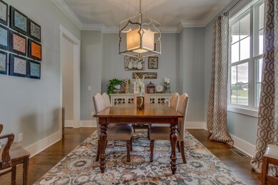 The dining room is your first focus upon entering--note the light fixture.