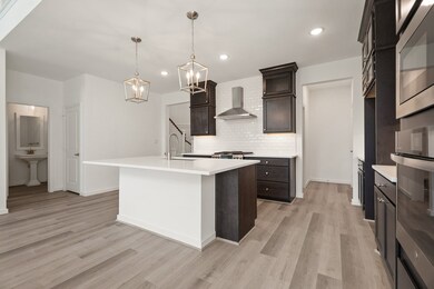 Kitchen with stainless-steel appliances & wall oven