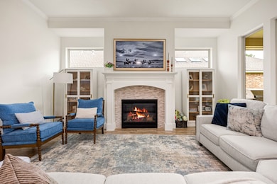 Beautiful fireplace in living room is flanked by w