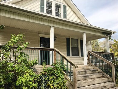 Front of house facing Main St. Relaxing, covered f