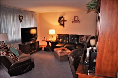 LIVING ROOM BOASTS LARGE WINDOW