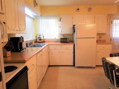 Plenty of cabinets and natural light with corner w