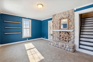 Main floor living room with decorative fireplace!