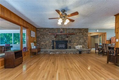 Upstairs large living room area with fireplace