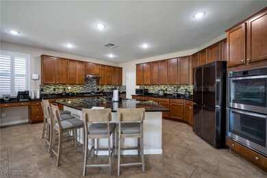 Kitchen with freestanding refrigerator, double ove