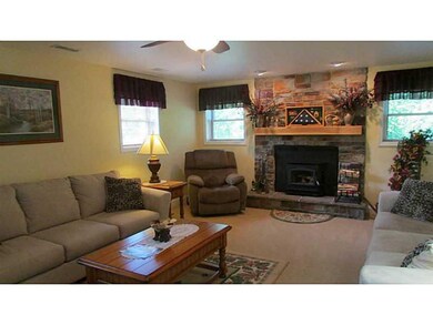 Family Room. Welcoming family room with Buck Stove
