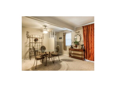 Dining area with ceiling fan.