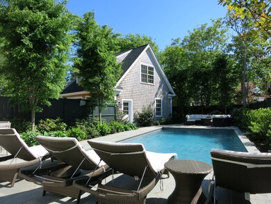 Garage with guest bedroom beside the pool